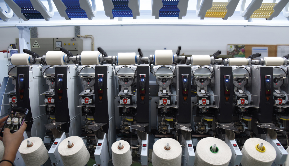 When the yarns, which are spun on paper bobbins, arrive to the vertical mills they’re respun on plastic bobbins with holes that allow the dye to permeate the yarn.